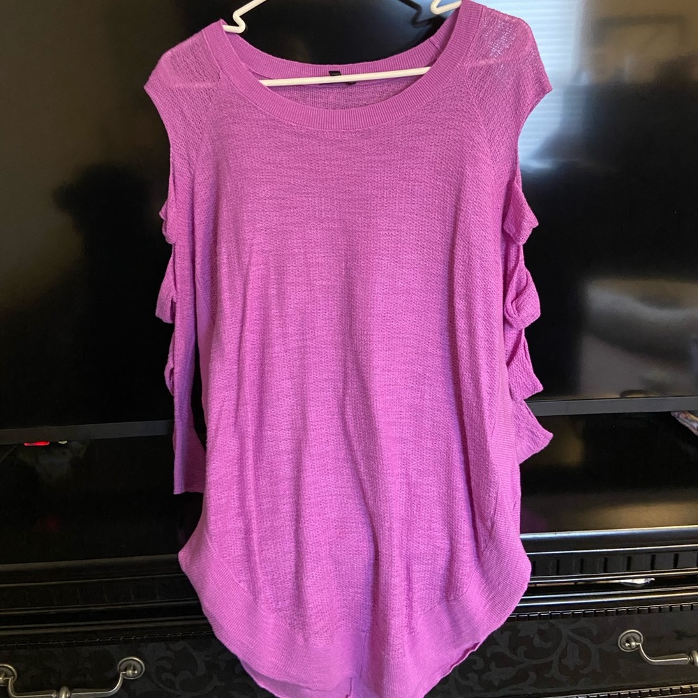 Bright purple sweater with cut outs down the arm